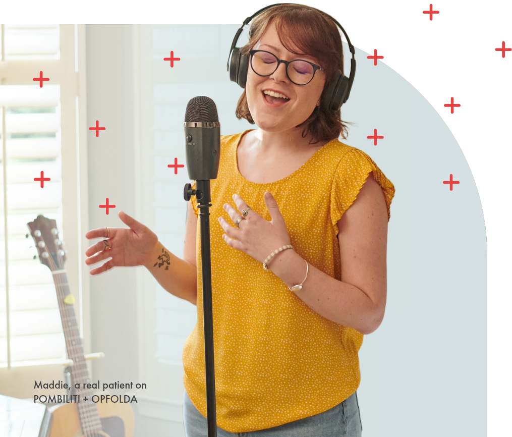 marquee Ambassador Maddie, who was diagnosed with LOPD in 2009, singing into a microphone